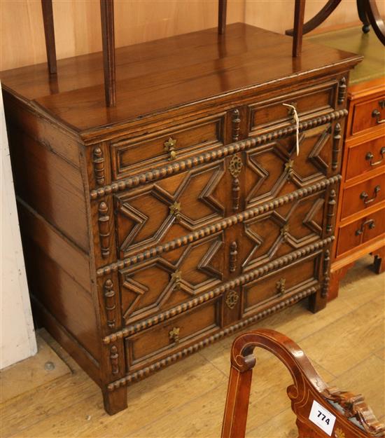 A Jacobean style oak chest W.93cm